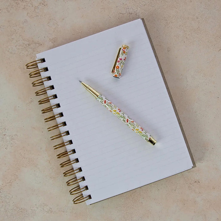 A5 Journal (Lined) - Gumnut Dance. Eco friendly, Australian made lined A5 journal. It contains 200 lined pages within a super sturdy hard cover, which features inspiring native botanical artwork by Australian artist Jayne Branchflower. 