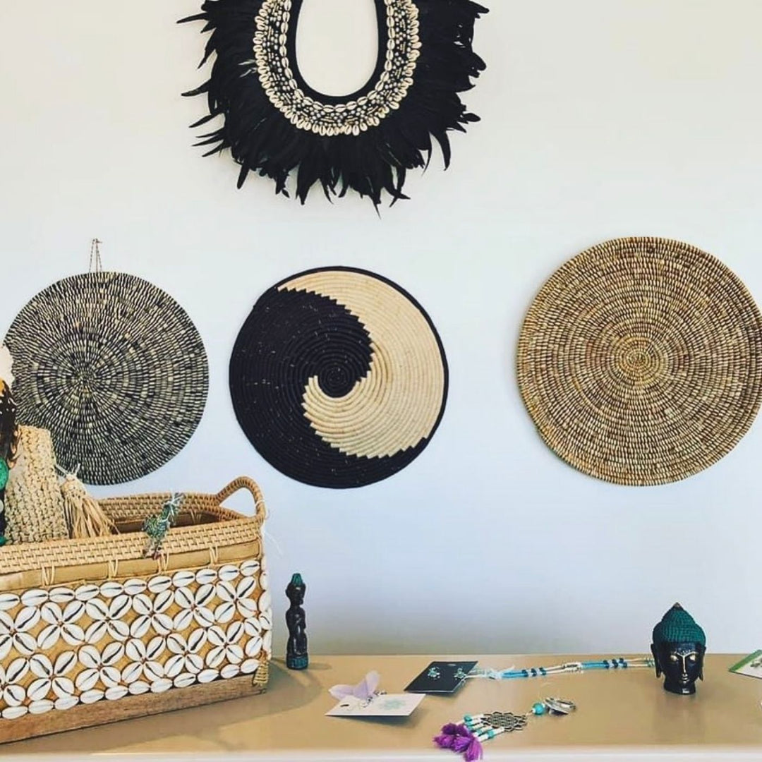 Wall display with AfriBeads baskets at this beautiful eclectic homewares store. Artisan goods celebrating African craft. Home decor, baskets, and jewelry that are handmade and ethically produced in Africa.