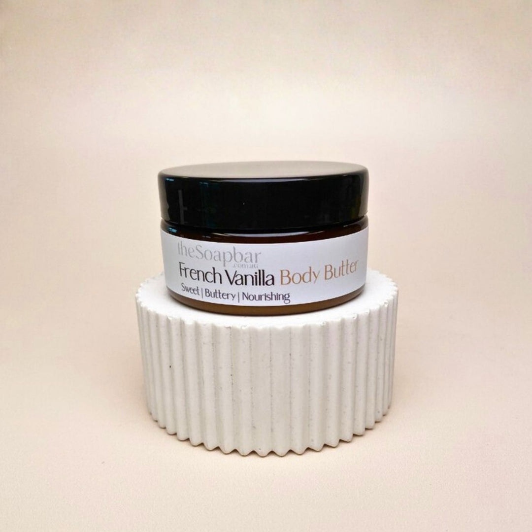 French Vanilla Body Butter Small 80g by The Soap Bar, amber glass jar with black lid on neutral background.