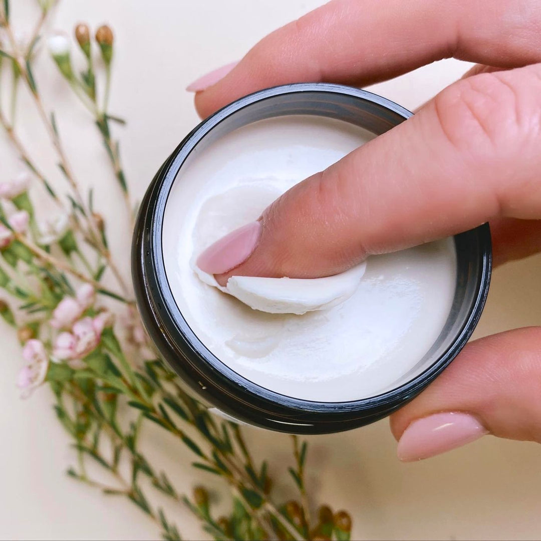 French Vanilla Body Butter 80g with creamy texture, shown open as balm is scooped from amber jar.