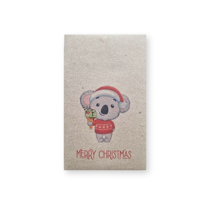 Christmas Koala seed card with koala in Santa hat holding ice cream, Merry Christmas text, styled with flowers on a white background