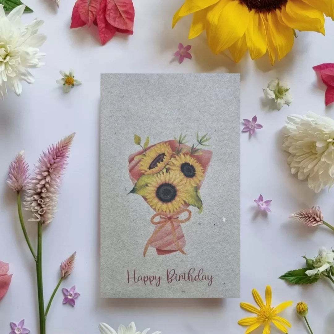 Happy Birthday sunflower seed card by Bee Kind Australia, recycled greeting card with sunflower bouquet design surrounded by real flowers.