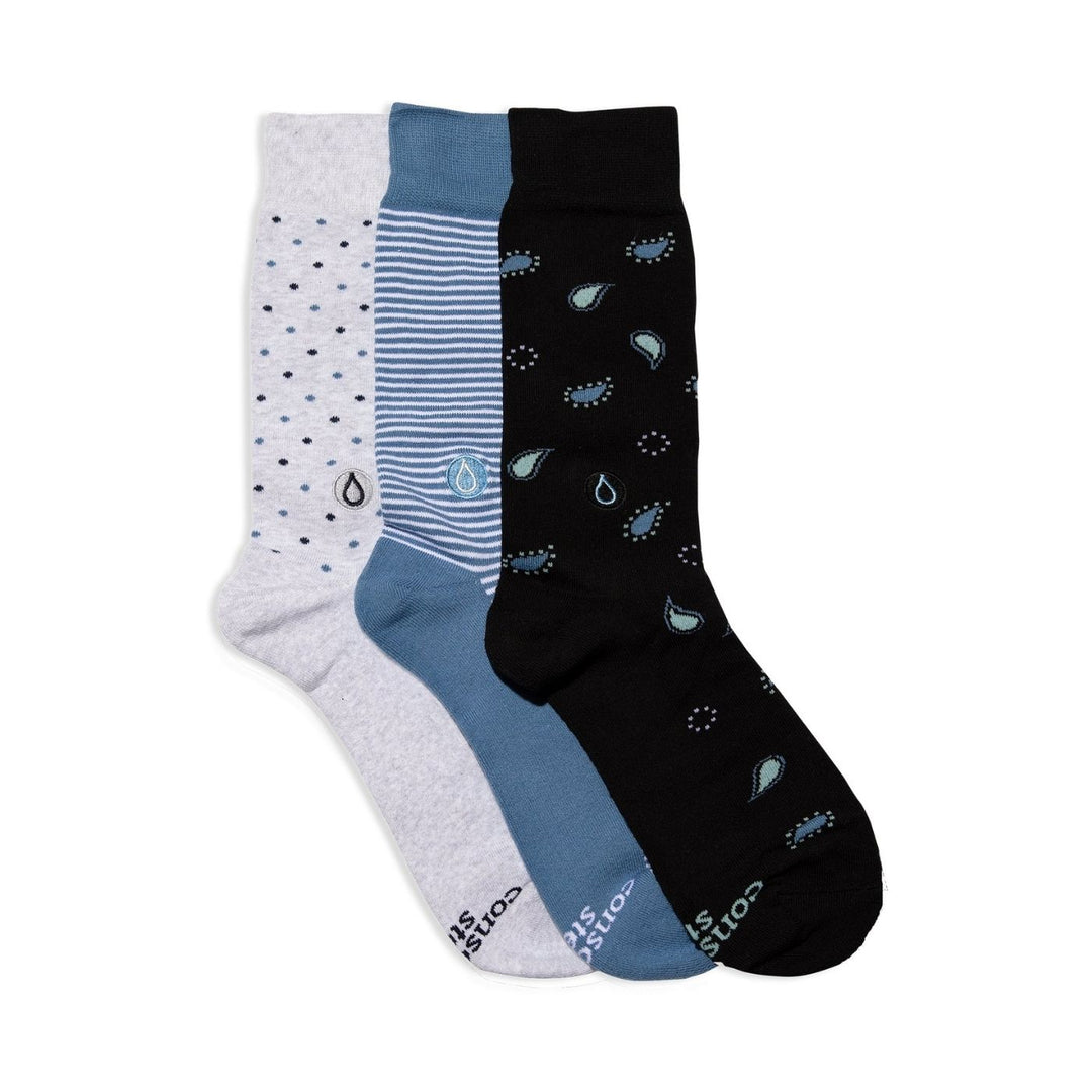 Conscious Step - Give Water Gift Box is a 3-pack set of comfy, organic cotton socks designed to support access to safe water globally. Each box includes three pairs in blue-striped, grey-polka dot, and blue paisley patterns. Knit from Fairtrade, GOTS-certified and vegan materials, these socks deliver soft cushioning, durable comfort and a clean, classic look.