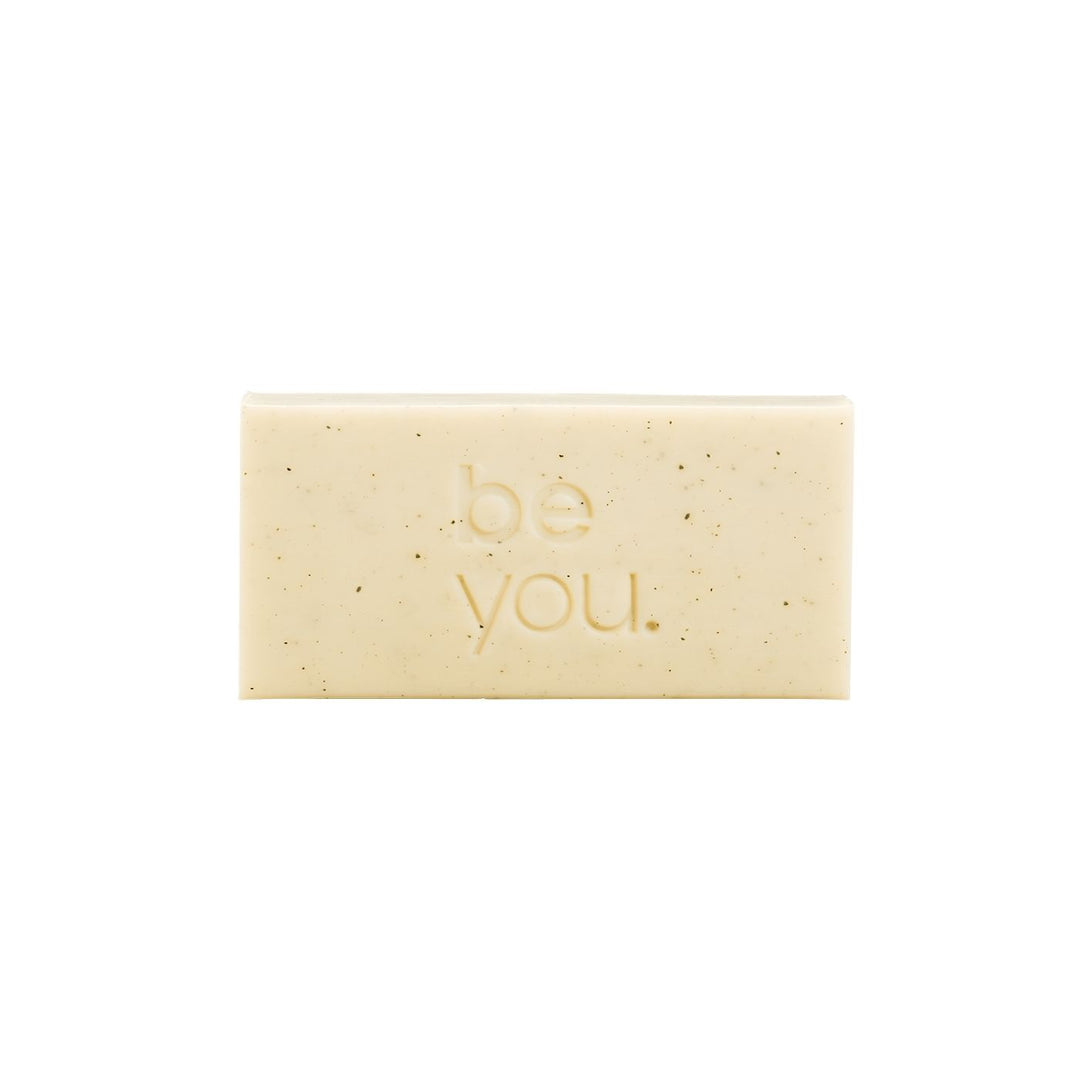 Unlabelled Exfoliating Body Bar - Geranium and cedarwood exfoliating body bar by Unlabelled with collagen, natural exfoliating soap bar for smooth skin, front view on white background