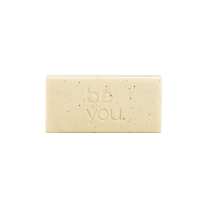 Unlabelled Exfoliating Body Bar - Geranium and cedarwood exfoliating body bar by Unlabelled with collagen, natural exfoliating soap bar for smooth skin, front view on white background