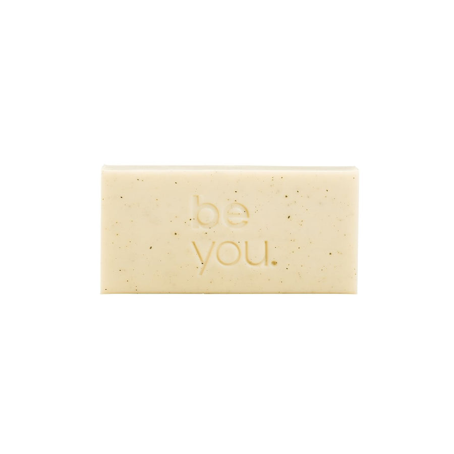 Unlabelled Exfoliating Body Bar - Geranium and cedarwood exfoliating body bar by Unlabelled with collagen, natural exfoliating soap bar for smooth skin, front view on white background