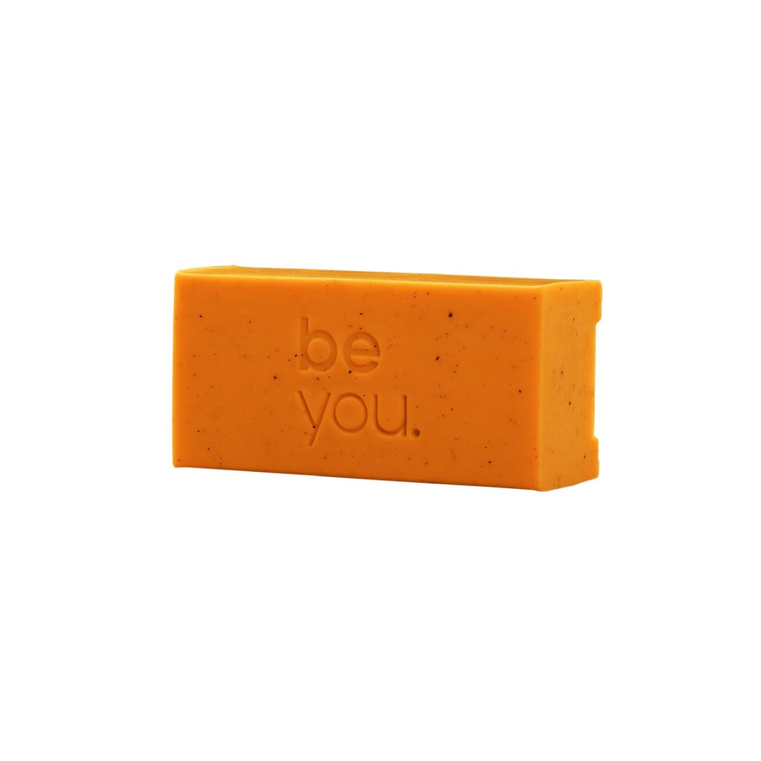Unlabelled Orange Mandarin Collagen Exfoliating Body Bar on white background, natural exfoliating soap bar for smooth skin, youth mental health support product