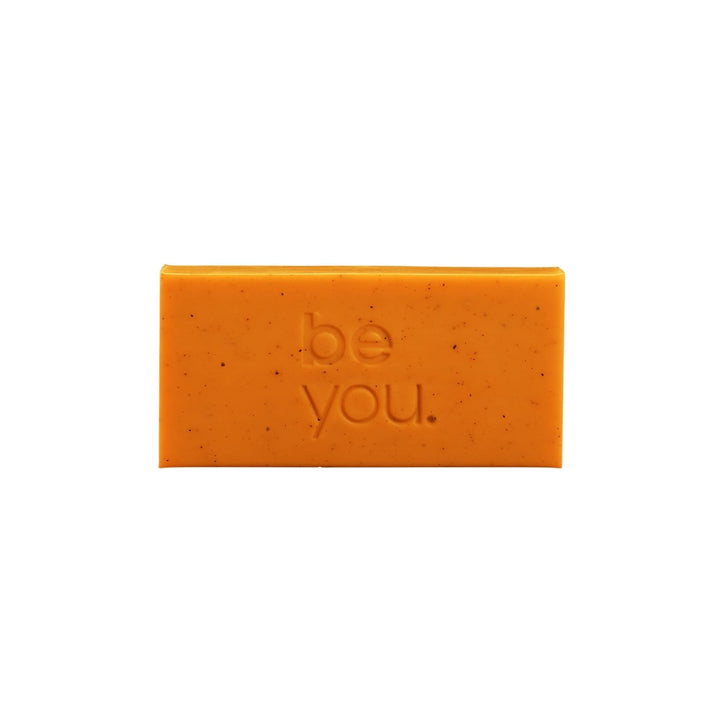 Unlabelled Orange Mandarin Collagen Exfoliating Body Bar on white background, natural exfoliating soap bar for smooth skin, youth mental health support product