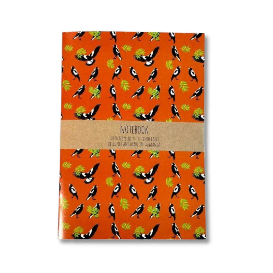 Red Parka Magpie A5 Notebook – Designed in Tasmania

A5 notebook with vibrant art by Jennifer Cossins. Printed in Tasmania on 100% recycled paper. 50% of profits support Aussie wildlife and environmental causes.