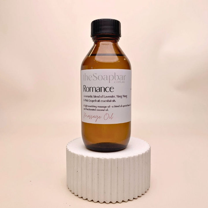Romance Massage Oil by The Soap Bar in amber glass bottle, made with apricot kernel oil and coconut oil, scented with lavender and ylang ylang essential oils.