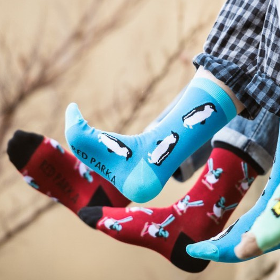Red Parka Penguin Kids' Socks – Designed in Tasmania. Fun, colourful Penguin socks for kids, designed in Tasmania. Made from soft bamboo. 50% of profits support wildlife and environmental charities.