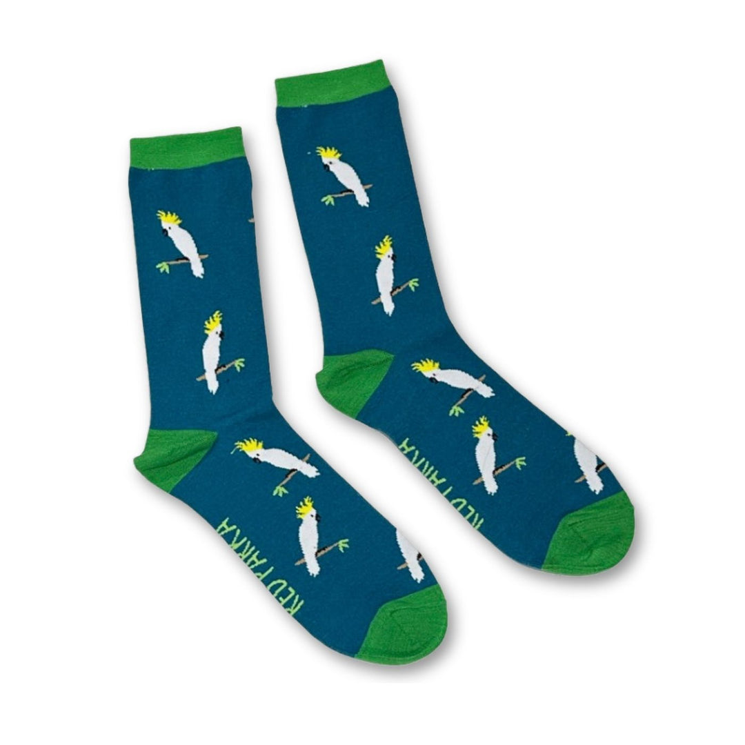 Red Parka Sulphur-Crested Cockatoo Socks - Bright, playful, and full of personality — these cosy socks are designed in Tasmania by local artists Jennifer Cossins and Tracey Colhoun. These socks add a splash of fun to any outfit.