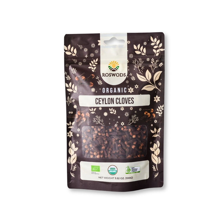 Roswods Organic Ceylon Cloves 100g resealable dark brown pouch with botanical packaging, whole cloves visible through a clear window, and Bio, USDA Organic, and ACO Certified Organic badges at the base.