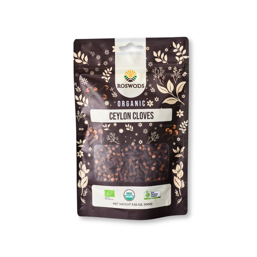 Roswods Organic Ceylon Cloves 100g resealable dark brown pouch with botanical packaging, whole cloves visible through a clear window, and Bio, USDA Organic, and ACO Certified Organic badges at the base.
