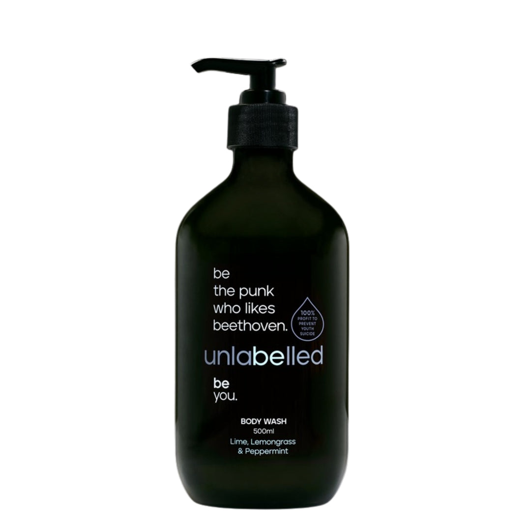 Unlabelled Body Wash - 500ml bottle with lime, lemongrass, and peppermint scent. Sleek black packaging with an empowering message: 'be the punk who likes beethoven'. Unlabelled is a not-for-profit social enterprise dedicated to transforming youth mental health in Australia. With 100% of profits funding critical mental health initiatives.
