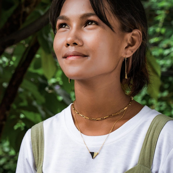 Eden Be Light Necklace Bundle is handcrafted with black glass beads and 18K gold-plated stainless steel, these ethical earrings support women rebuilding their lives through Eden’s programs.