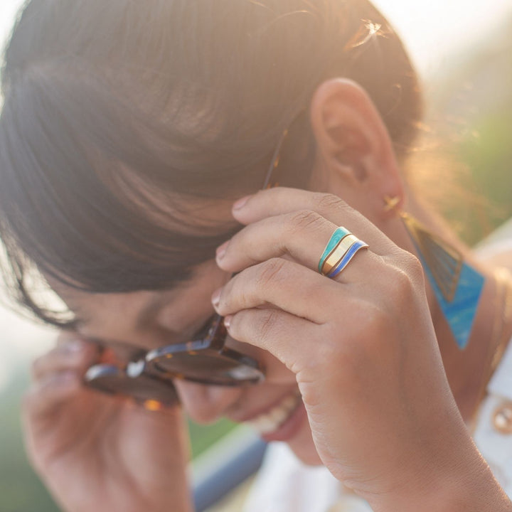 Eden - Parting Waters Ring. Elegant gold-plated ring with a modern open design. A meaningful piece that supports Eden’s work with survivors of trafficking.
