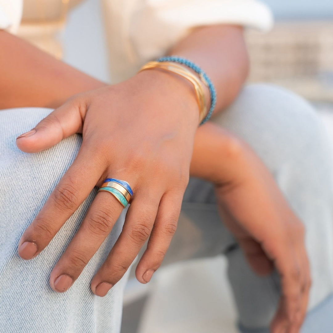 Eden - Parting Waters Ring. Elegant gold-plated ring with a modern open design. A meaningful piece that supports Eden’s work with survivors of trafficking.