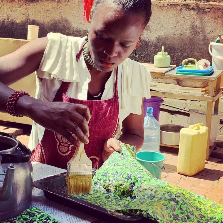 Every piece is hand-crafted and unique. Making wax wraps in Uganda. African brightly coloured cotton and natural bees wax.