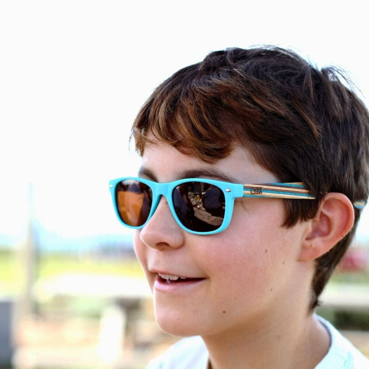 Sustainable SOEK Sunglasses - Little Shelly Kids Polarised Sunnies. Stylish, sustainable eyewear that gives back — SOEK plants one tree for every pair sold. Look good, do good, and help reforest the planet with every purchase.